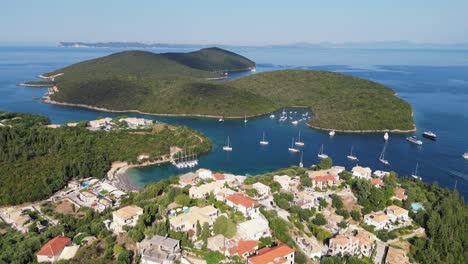 Syvota-Coastal-Village,-Boats-and-Islands-in-Ionian-Sea,-Epirus,-Greece-Mainland---Aerial-Circling