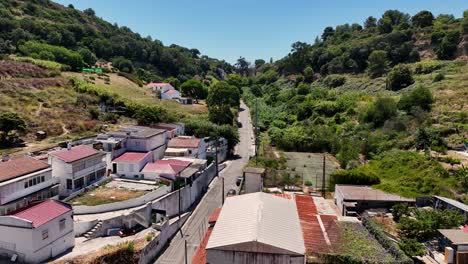 Drone-shot-filming-up-the-hill-at-Porto-Brandao-in-Portugal