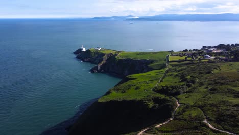 Aerial-Fly-By-over-Dramatic-Coastline-of-Howth,-Ireland