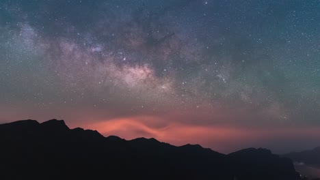 night-timelapse-of-milky-way-and-star-rising-over-crater-rim-mountains-in-La-Palma-Island,-Canary-Islands,-Spain