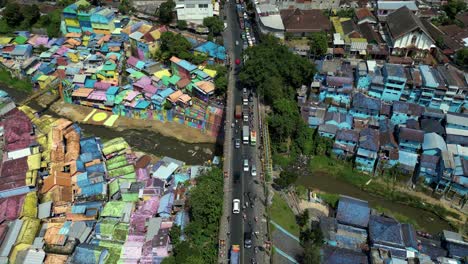 Touristic-spot-in-Malang,-East-Java---aerial-view-of-the-two-touristic-villages---Jodipan-"rainbow"-village-and-the-blue-city---Indonesia