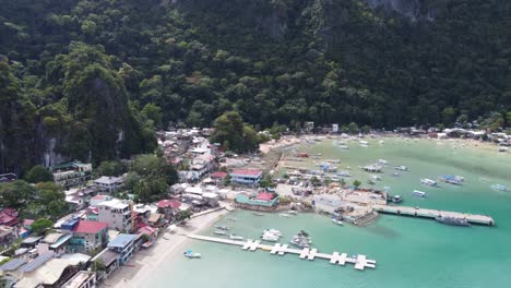 Breathtaking-Aerial-View:-El-Nido-Bay-and-Town-Nestled-in-the-Serene-Beauty-of-Bacuit-Bay,-Palawan,-Philippines