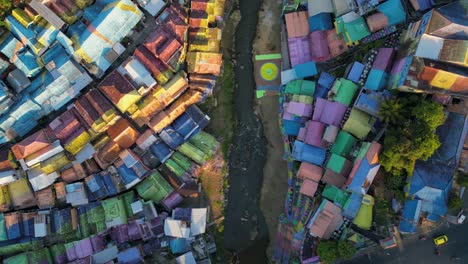 Aerial-view-looking-down-to-the-famous-Jodipan-village-aka-Rainbow-village-in-the-city-of-Malang,-East-Java---Indonesia