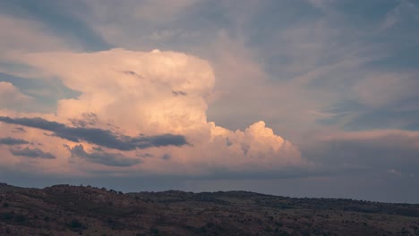 timelapse-stormy-sky-with-cumulonimbus-cloud-forming-and-lit-by-setting-sun-during-sunset-in-Madrid-rural-area