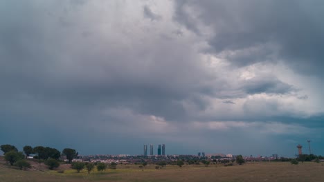 Timelapse-cloudy-and-stormy-sky-in-Madrid-skyline-during-sunset-day-to-night-city-lights