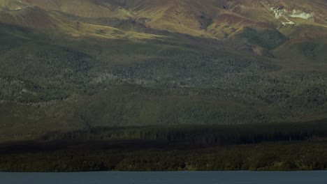 Establishing-shot-of-Mount-Tongariro-seen-from-lake-Rotoaira-in-New-Zealand-landscape