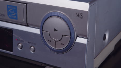Insert-a-VHS-tape-into-the-VCR-and-press-the-play-button
