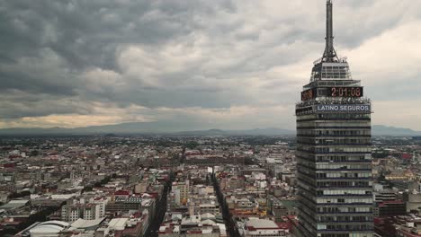 Aerial-Scenes-of-Historic-District:-Torre-Latinoamericana-Exploration,-Mexico-City,-in-the-background-the-zocalo-of-the-city