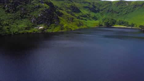 Aerial-Reveal-of-a-Beautiful-Mountain-Landscape-and-a-Lake-in-Ireland's-Mountains