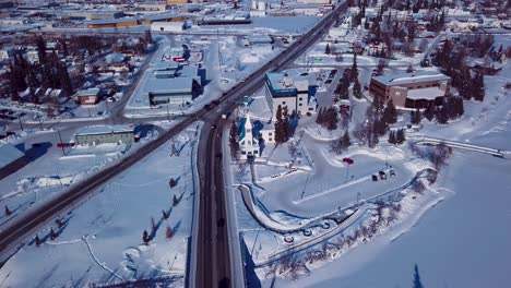 4K-Drone-Video-of-Immaculate-Conception-Catholic-Parish-on-the-Banks-of-the-Frozen-Chena-River-in-Downtown-Fairbanks-Alaska-on-Snowy-Winter-Day
