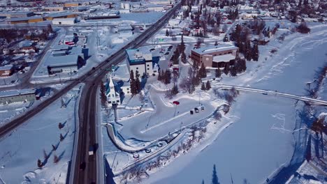4K-Drone-Video-of-The-William-Ransom-Wood-Centennial-Bridge-over-Frozen-Chena-River-in-Downtown-Fairbanks-Alaska-on-Snowy-Winter-Day