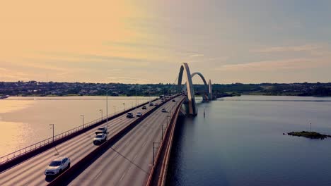 Traffic-over-JK-bridge-in-brasilia-on-sunset,-aerial-view