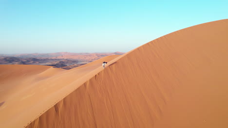 Hiker-On-The-Sand-Dunes-Of-Djanet-Desert-In-Algeria