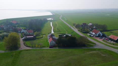 Giethoorn-village-house,-road-and-car---flying-sideways