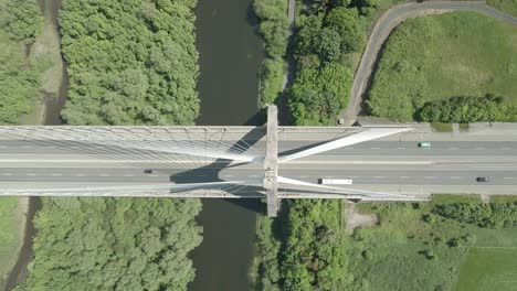 Overhead-View-Of-Cars-Driving-On-The-Mary-McAleese-Boyne-Valley-Bridge-Spanning-The-Boyne-River-In-County-Louth,-Ireland