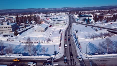 4K-Drone-Video-of-Barnette-Street-Bridge-over-Frozen-Chena-River-in-Downtown-Fairbanks-Alaska-on-Snowy-Winter-Day