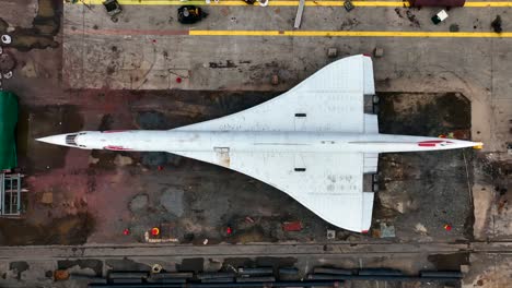 A-top-down-view-of-the-Brooklyn-Navy-Yard-with-the-British-Airways-Concorde-in-view,-waiting-to-be-restored-after-being-on-display-on-the-Intrepid-since-2003