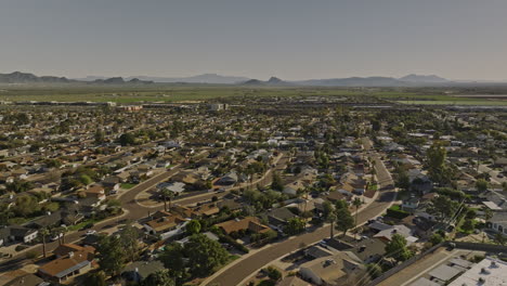 Scottsdale-Arizona-Aerial-v1-panoramic-panning-view-above-Chateau-De-Vie-neighborhood-capturing-tillable-farmland,-cityscape-of-desert-city,-camelback-mountain---Shot-with-Mavic-3-Cine---February-2022