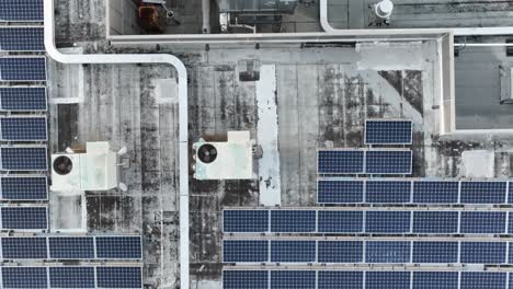 Top-down-aerial-shot-of-solar-panels-on-industrial-roof