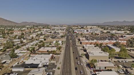 Scottsdale-Arizona-Aerial-v12-low-flyover-straight-above-north-road-across-old-town-neighborhood-capturing-urban-downtown-cityscape-of-desert-city-at-daytime---Shot-with-Mavic-3-Cine---February-2022