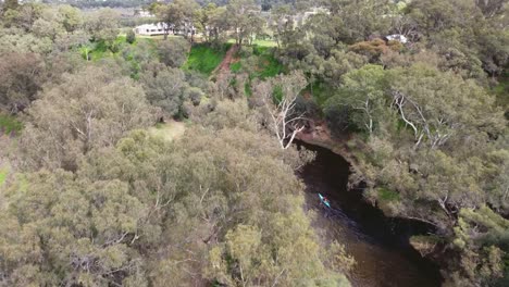 Aerial-Follow-Shot-Of-Kayakers-Paddling-Along-The-Swan-River-At-The-Avon-Descent-Boat-Race