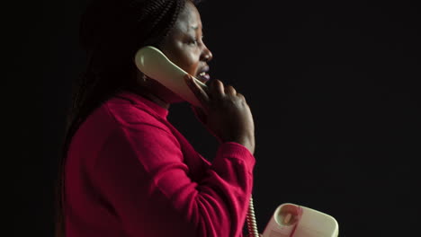 Woman-Talking-Through-Landline-Phone