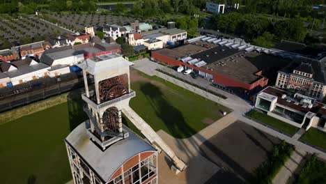 Old-mining-shaft-building-facilities-in-Genk,-Belgium,-aerial-drone-view