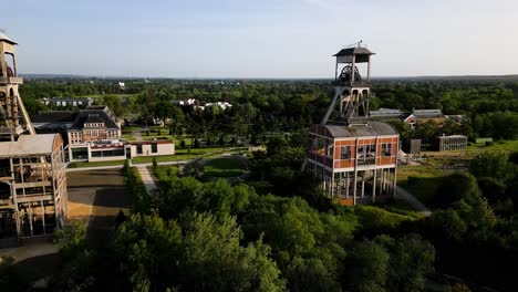 Old-mining-shaft-complex-towers-in-Genk,-aerial-drone-view