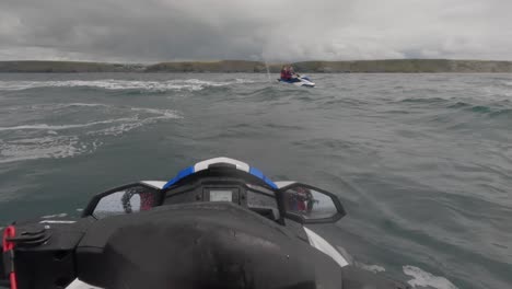POV-shot-of-jet-skiers-regrouping-off-the-coast-of-Newquay,-Cornwall