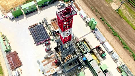 Oil-And-Gas-Onshore-Drilling-Rig-In-Austria-During-Summer---aerial-drone-shot
