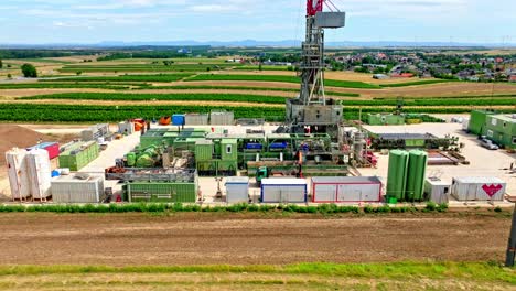 Drilling-Rig-In-Agricultural-Fields-In-Austria---aerial-drone-shot