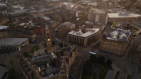 Establishing-Drone-Shot-Over-Bradford-City-Centre-and-Town-Hall-at-Golden-Hour