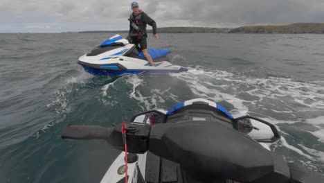 POV-shot-of-a-jet-ski-instructor-giving-tips-to-a-jet-skier-off-the-coast-of-Newquay