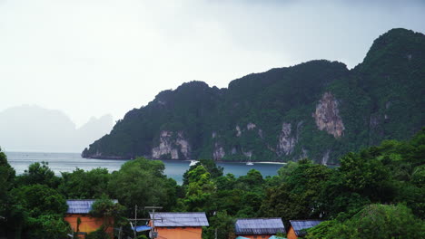 Wide-shot-showing-beautiful-coastline-with-green-mountains-and-bay-on-Koh-Phi-Phi-Island,-Thailand