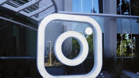 Instagram-company-logo-in-front-of-headquarters-building,-establishing-view