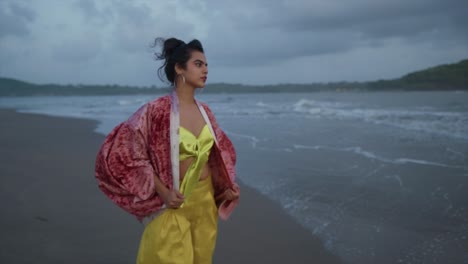 Beautiful-indian-asian-model-woman-walking-along-tropical-beach