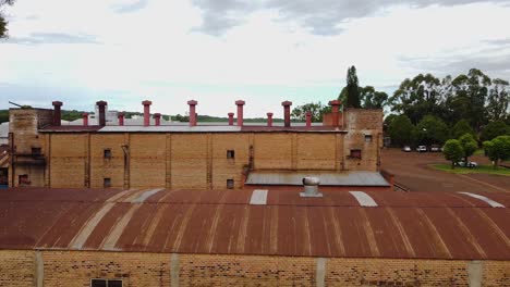 Roof-Extractor-Fan-And-Chimneys-On-The-Rooftop-Of-Yerba-Mate-Production-Plant-In-Apostoles,-Misiones,-Argentina