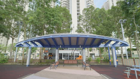 Purple-shade-covering-above-benches-at-childrens-play-park-in-hong-kong-suburb