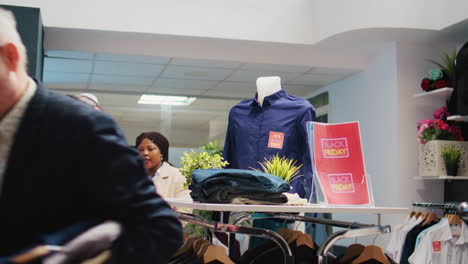 Customers-choosing-clothes-from-racks