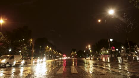 Car-ride-timelapse-through-Paris,-France-at-night-captures-the-busy-city,-with-car-lights,-street-lights-and-buildings-illuminating-the-scene