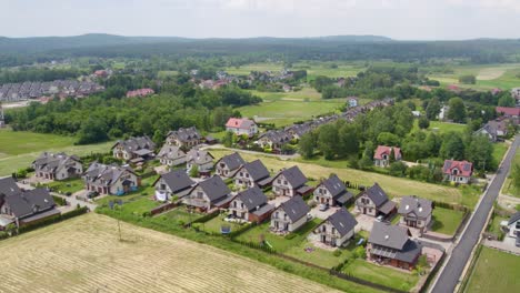 Aerial-shot-of-Modern-Neighborhood-And-Fields-at-Summertime