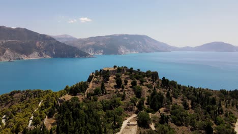 Picturesque-mountain-top-on-Peninsula-Asos-in-Kefalonia,-Greece,-cinematic-drone