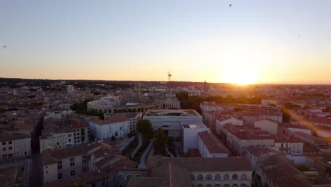 Establishing-shot-of-the-Musée-de-la-Romanité-with-the-Nimes-arena-behind-at-sunset