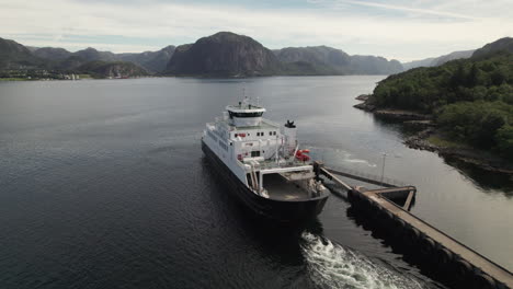 Aerial-View-of-a-Car-Ferry-Departing-from-the-Dock-to-Cross-a-Beautiful-Fjord-in-Norway,-Lauvvika-Oanes,-Near-Stavanger,-Summer-Sunny-Day