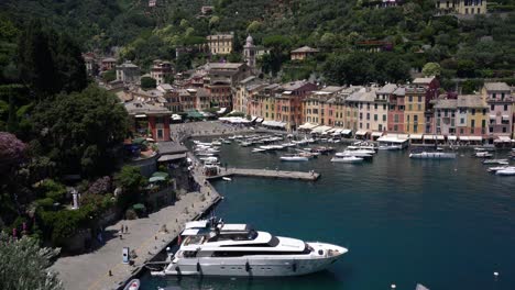 Picturesque-scenic-bird's-eye-view-of-the-town-and-harbour-of-Portofino,-Italy,-is-renowned-for-its-stunning-natural-beauty,-colourful-buildings,-and-luxurious-lifestyle