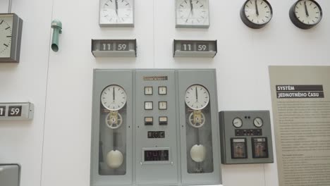 Double-pendulum-clock-on-display-Inside-National-Technical-Museum-in-Prague,-Czech-Republic,-static-shot