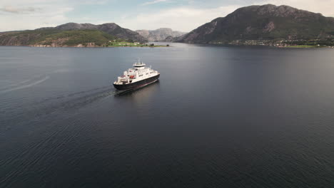 Impressive-Rotating-Drone-Shot-of-a-Car-Ferry-Crossing-a-Beautiful-Fjord-in-Norway,-Lauvvika-Oanes,-Near-Stavanger,-Summer-Sunny-Day