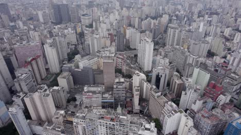 High-aerial-tilt:-Monochromatic-hazy-city-skyline-of-Sao-Paulo,-Brazil