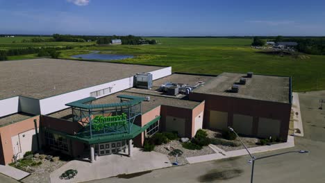 An-Exterior-Moving-Drone-Shot-of-the-Shamrock-Community-Recreational-Centre-and-Ice-rink-in-Small-Town-Municipality-Killarney-Manitoba-Canada