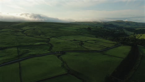 Establishing-Drone-Shot-Over-Hills-of-Yorkshire-Dales-on-Cloudy-Morning